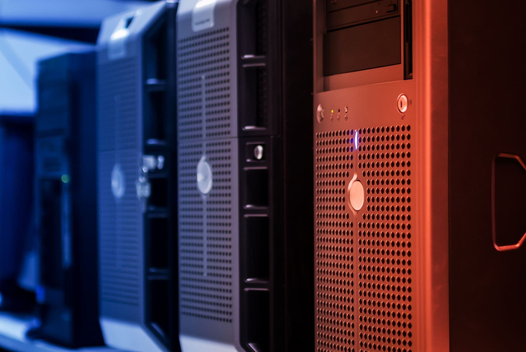 A row of servers lit in blue and red